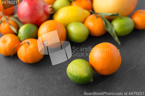 Image of close up of citrus fruits on stone table