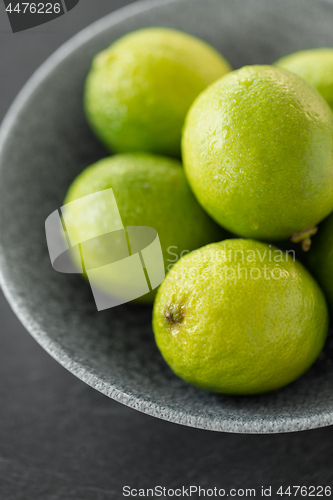 Image of close up of whole limes in bowl