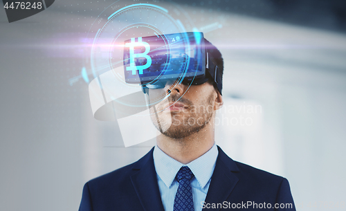 Image of cryptocurrency and businessman in virtual headset