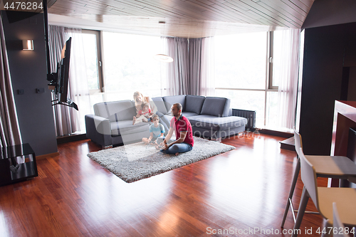 Image of Happy family playing a video game