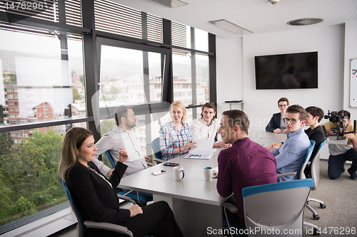 Image of Group of young people meeting in startup office