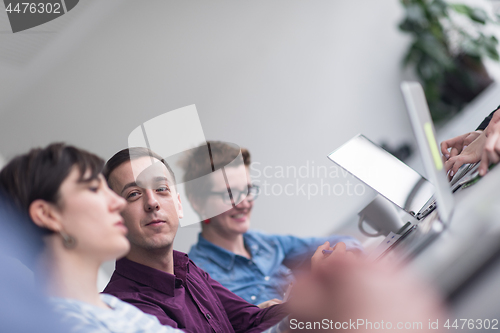 Image of Group of young people meeting in startup office