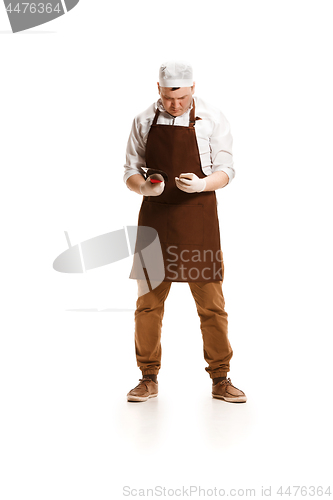 Image of Sad butcher posing with a cleaver isolated on white background