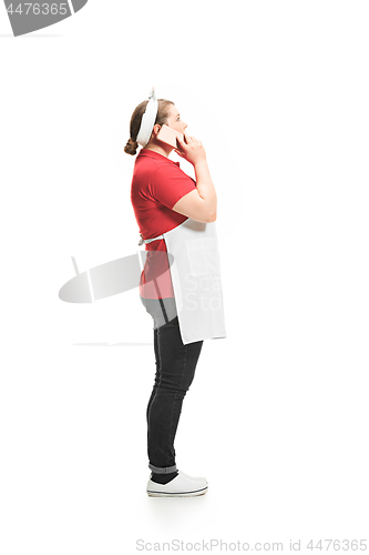 Image of Portrait of cute smiling woman with mobile phone in her hands in the studio, isolated on white background