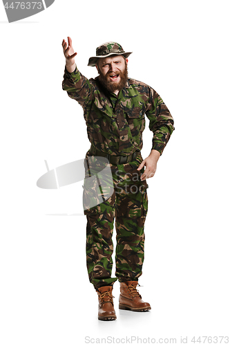 Image of Young army soldier wearing camouflage uniform isolated on white