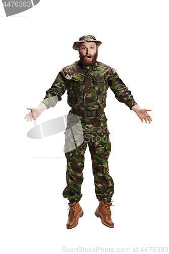 Image of Young army soldier wearing camouflage uniform isolated on white