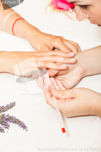 Image of Manicure of nails from a woman\'s hands before applying nail polish