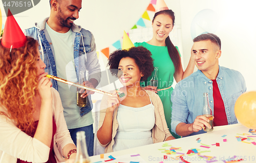 Image of happy team having fun at office party