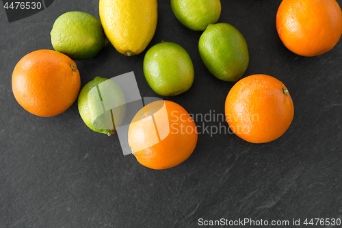 Image of close up of citrus fruits on stone table