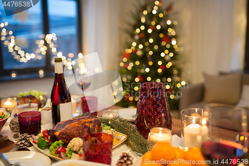 Image of food and drinks on christmas table at home