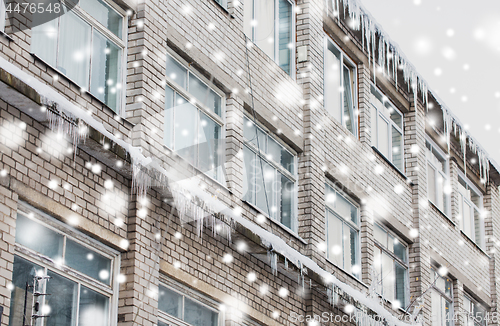 Image of icicles on building or living house facade