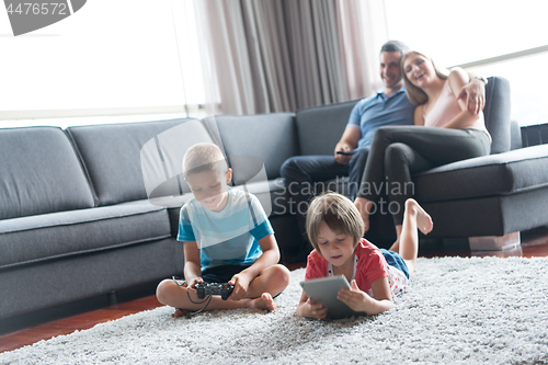 Image of couple spending time with kids