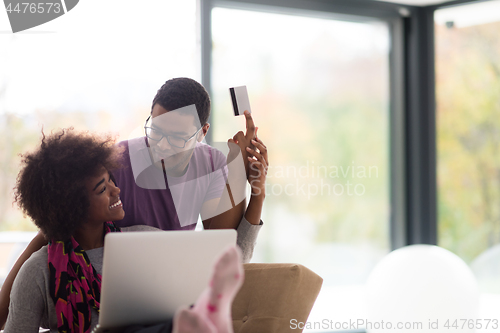 Image of african american couple shopping online