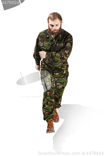 Image of Young army soldier wearing camouflage uniform isolated on white