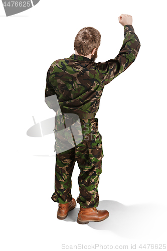 Image of Young army soldier wearing camouflage uniform isolated on white