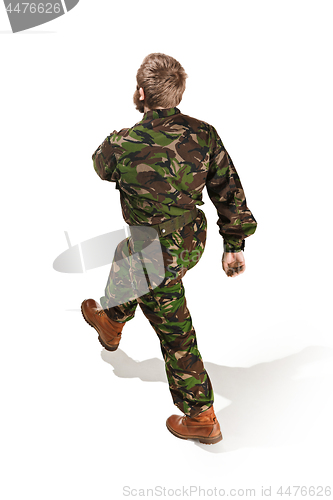 Image of Young army soldier wearing camouflage uniform isolated on white