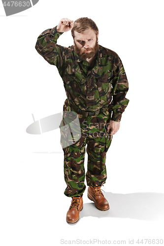 Image of Young army soldier wearing camouflage uniform isolated on white