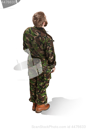 Image of Young army soldier wearing camouflage uniform isolated on white
