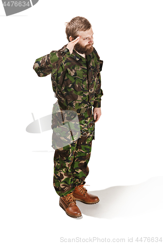 Image of Young army soldier wearing camouflage uniform isolated on white