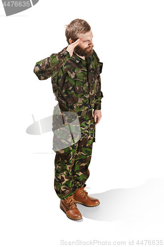 Image of Young army soldier wearing camouflage uniform isolated on white