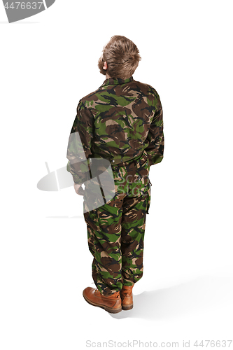 Image of Young army soldier wearing camouflage uniform isolated on white