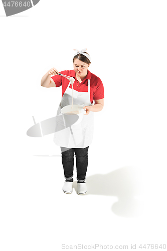Image of Portrait of cute smiling woman with bowl in her hands in the studio, isolated on white background