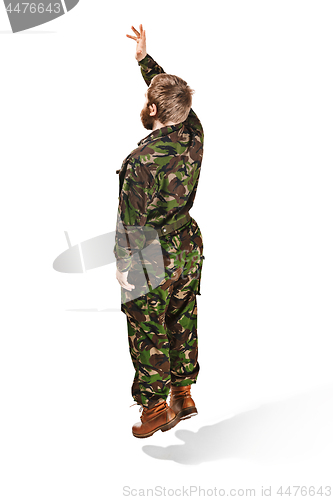 Image of Young army soldier wearing camouflage uniform isolated on white