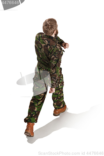 Image of Young army soldier wearing camouflage uniform isolated on white