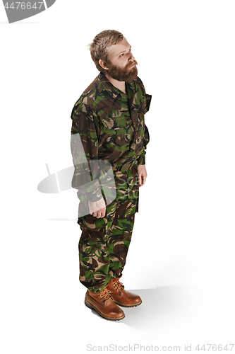 Image of Young army soldier wearing camouflage uniform isolated on white