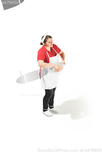 Image of Portrait of cute smiling woman with bowl in her hands in the studio, isolated on white background
