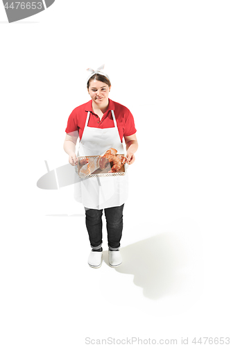 Image of Portrait of cute smiling woman with pastries in her hands in the studio, isolated on white background