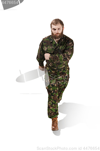 Image of Young army soldier wearing camouflage uniform isolated on white