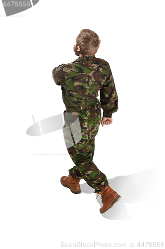 Image of Young army soldier wearing camouflage uniform isolated on white