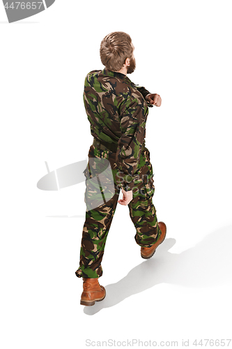 Image of Young army soldier wearing camouflage uniform isolated on white