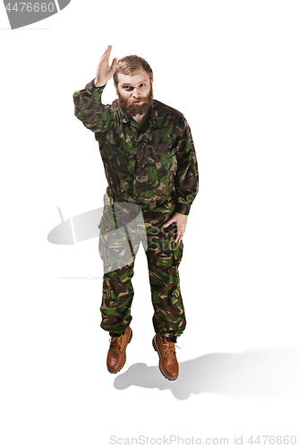 Image of Young army soldier wearing camouflage uniform isolated on white