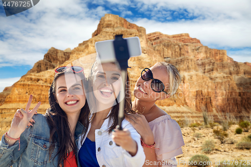 Image of female friends taking selfie over grand canyon