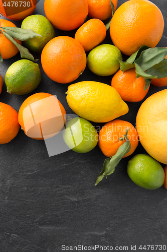 Image of close up of citrus fruits on stone table