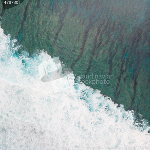 Image of Aerial shot of the braking wave in the ocean.