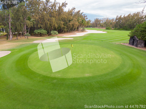 Image of Golf course hole green and sand traps.