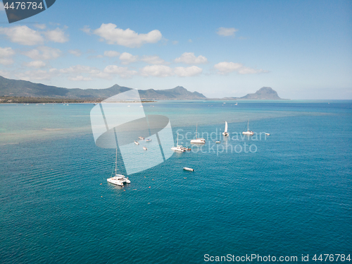 Image of Top down aerial view of boats on the reef of tropical beach of Black River, Mauritius island