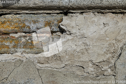 Image of Cracked concrete vintage brick wall