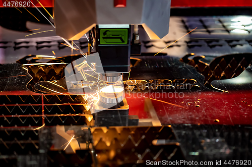 Image of CNC Laser cutting of metal, modern industrial technology.