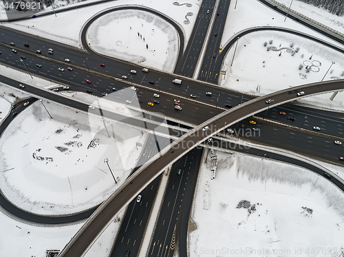 Image of Aerial view of a freeway intersection Snow-covered in winter.