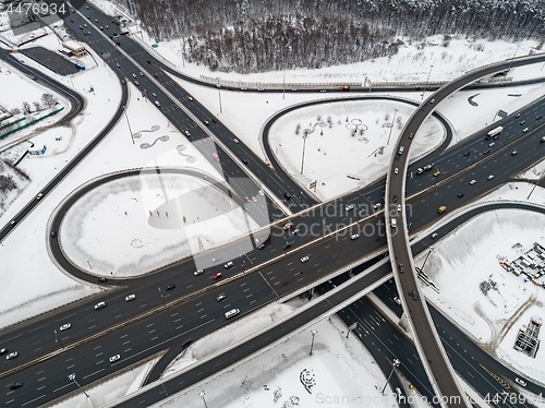 Image of Aerial view of a freeway intersection Snow-covered in winter.