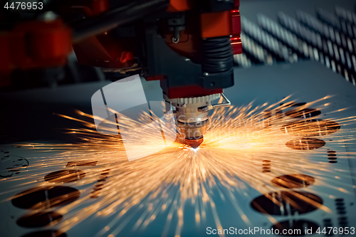 Image of CNC Laser cutting of metal, modern industrial technology.