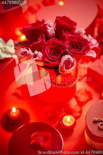 Image of Valentines day romantic decoration with roses, boxed gifts, candles