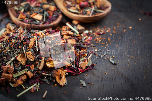 Image of Assorted dry tea on wooden background