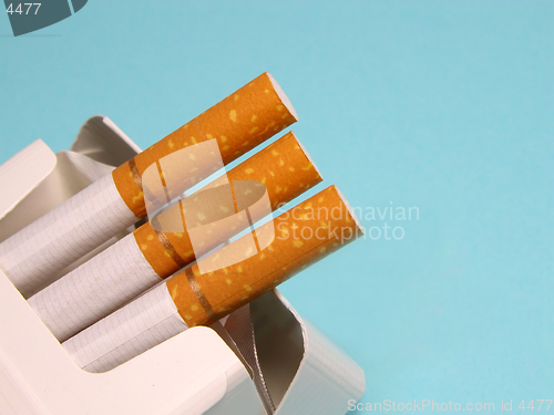 Image of Cigarettes over blue background