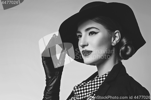Image of Beautiful woman in retro dress