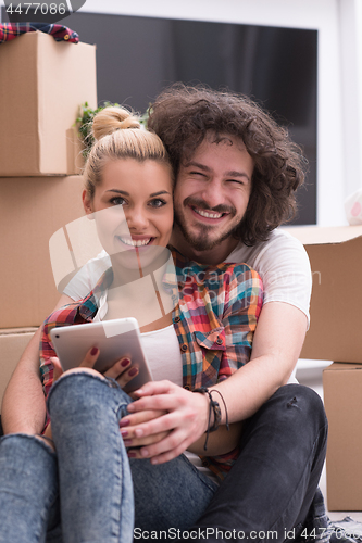 Image of young couple moving  in new house